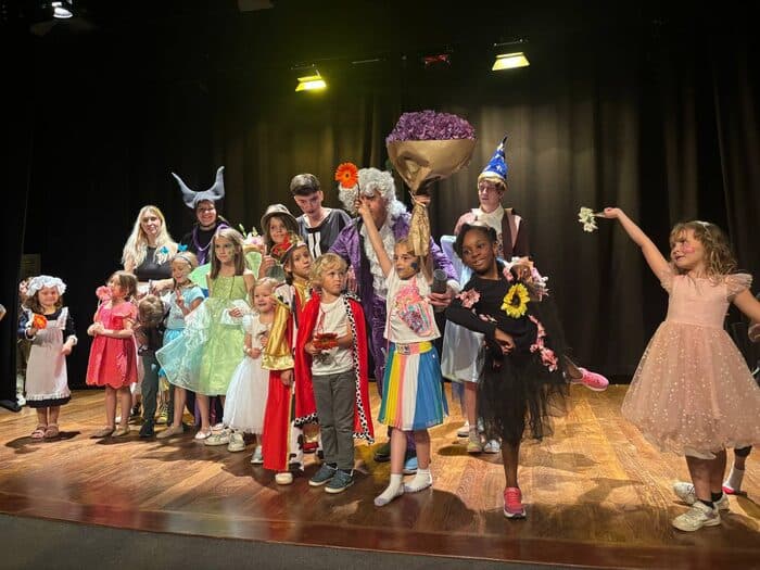 TISA students on stage during the school theatre production