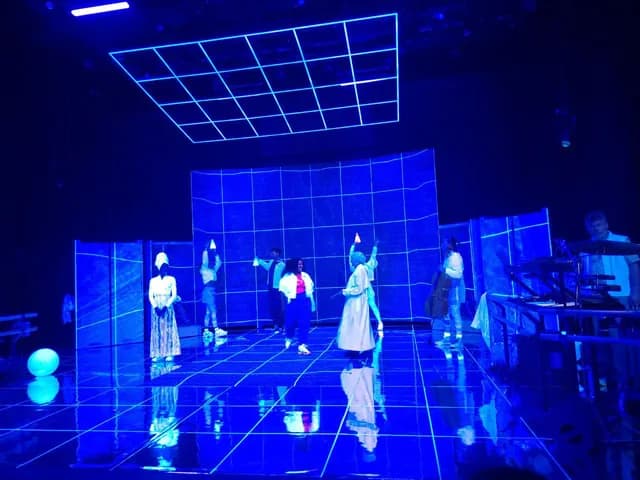 Students performing on stage during the annual school theatre production at TISA Leiden