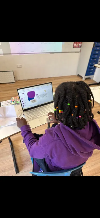 Student working independently on a laptop during Golden Hour project time at TISA Leiden