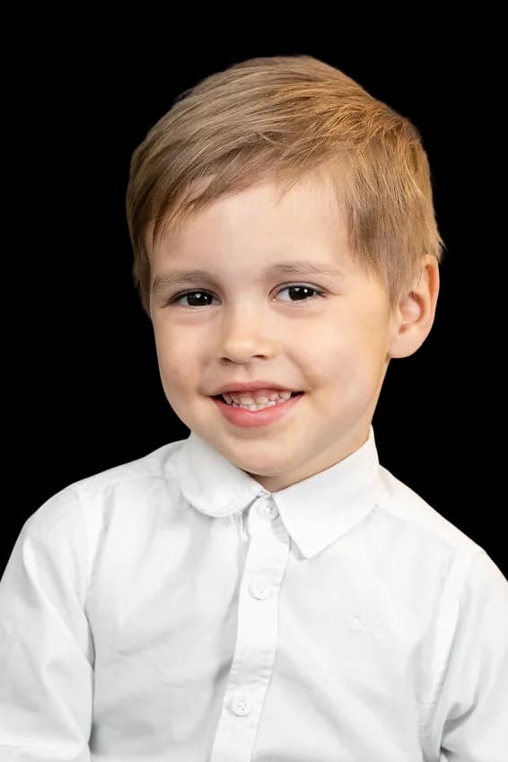 Studio headshot of a smiling TISA student